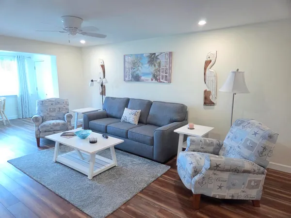 a living room with furniture and a rug