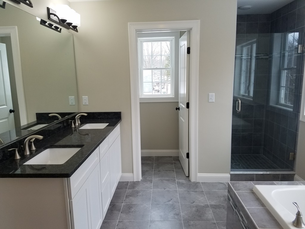 8 Anthony Road North Reading, MA 01864 - Photo 14 of 28 a bathroom with a sink and a mirror