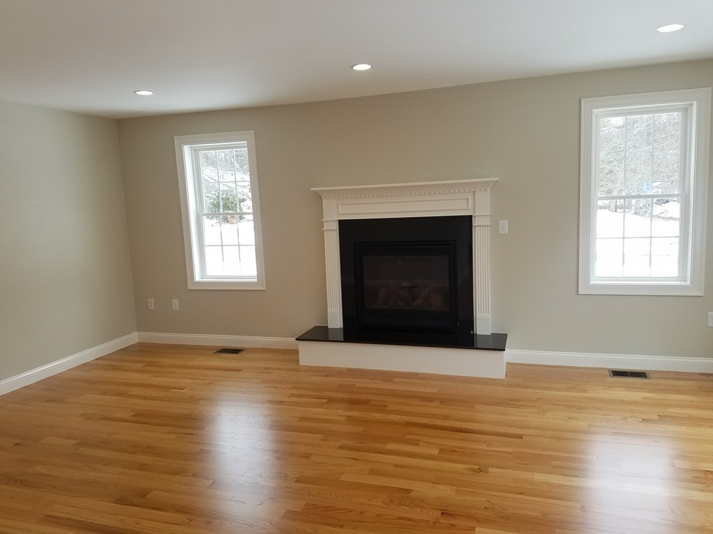 8 Anthony Road North Reading, MA 01864 - Photo 18 of 28 a view of an empty room with window and wooden floor