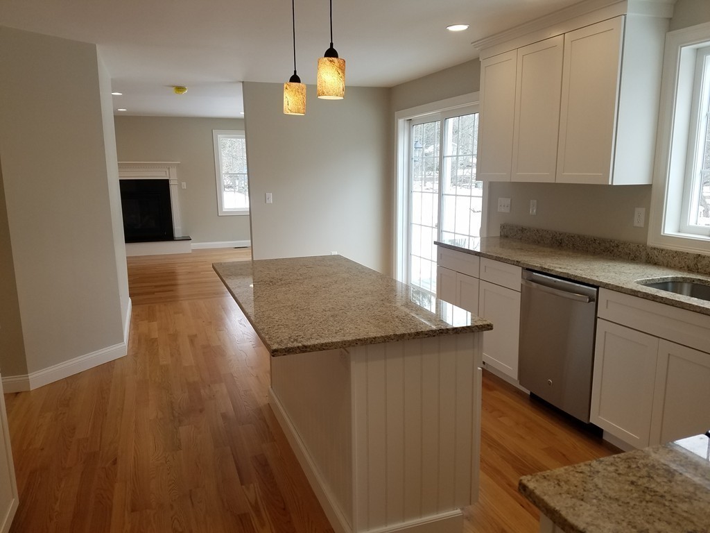 8 Anthony Road North Reading, MA 01864 - Photo 20 of 28 a kitchen with granite countertop a sink a counter space appliances and cabinets