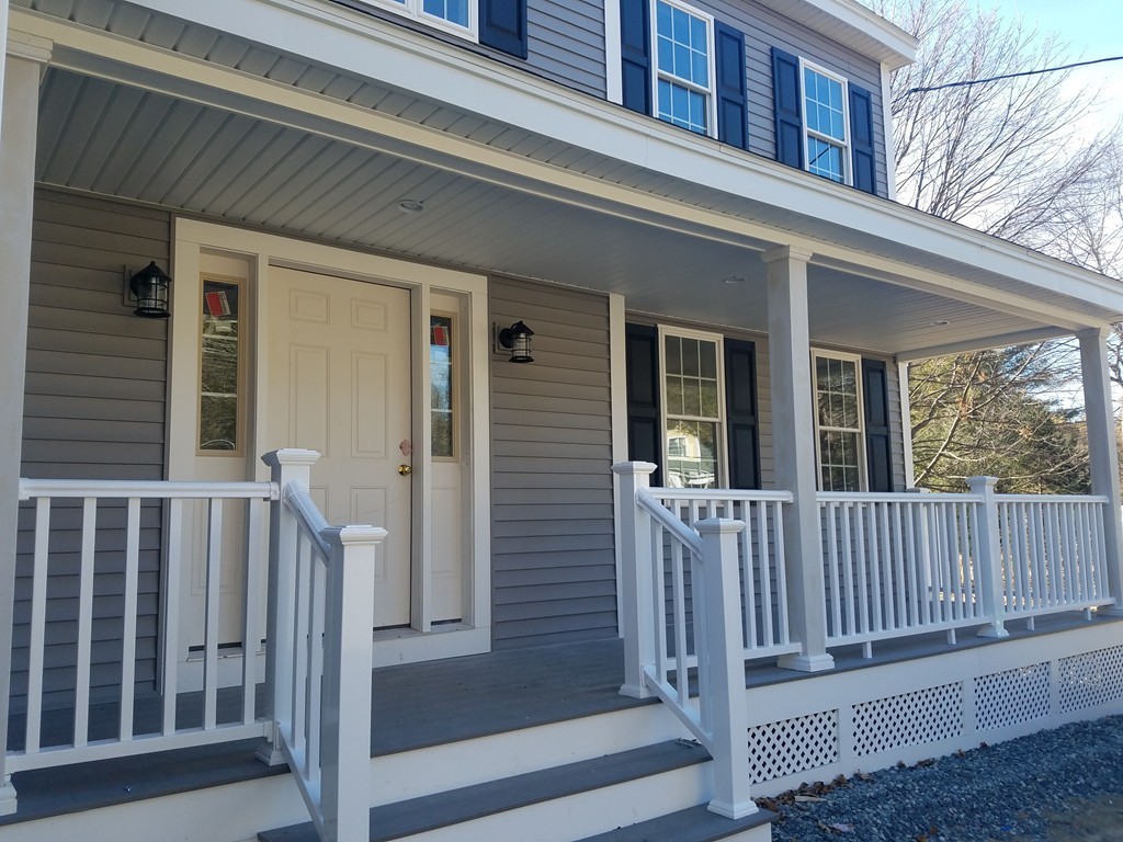 8 Anthony Road North Reading, MA 01864 - Photo 2 of 28 a view of a brick house with a small porch