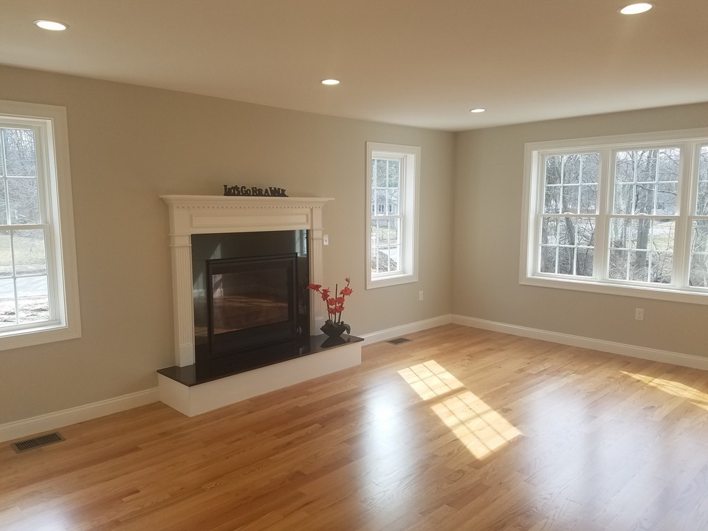 8 Anthony Road North Reading, MA 01864 - Photo 28 of 28 a view of an empty room with wooden floor and a window