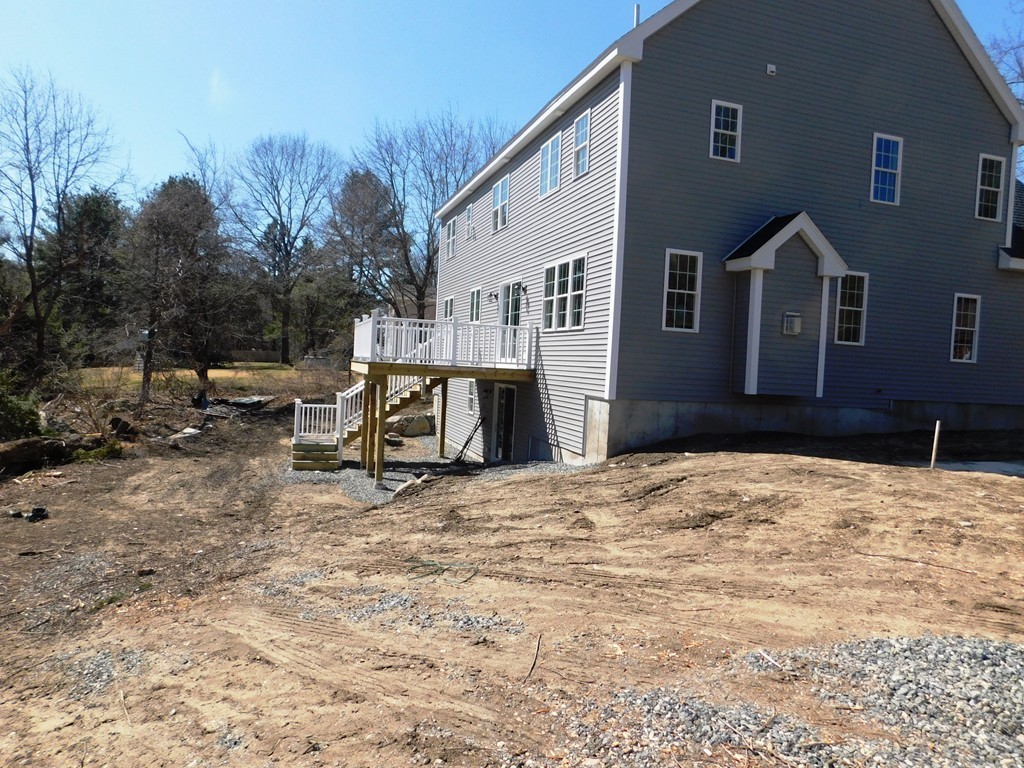 8 Anthony Road North Reading, MA 01864 - Photo 4 of 28 a wooden bench sitting in front of a house