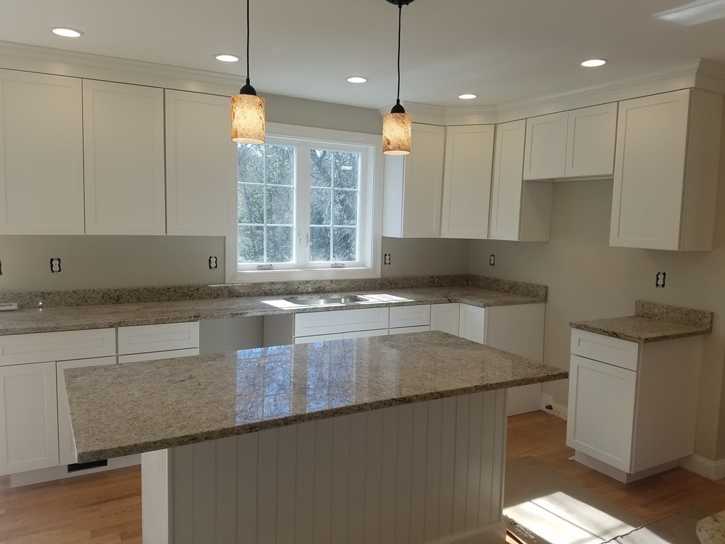 8 Anthony Road North Reading, MA 01864 - Photo 6 of 28 a kitchen with granite countertop a sink a counter top stainless steel appliances and cabinets