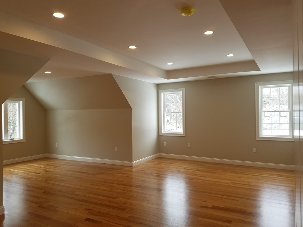 8 Anthony Road North Reading, MA 01864 - Photo 10 of 28 an empty room with wooden floor and windows
