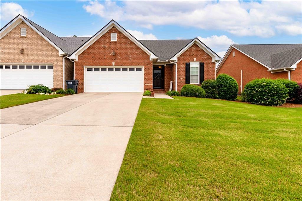153 Regency Row Southwest Calhoun, GA 30701 - Photo 1 of 1 a view of an house with backyard and garden