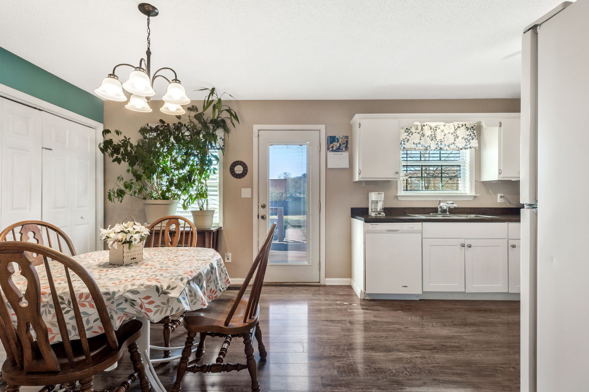 740 Happy Valley Road Bell Buckle, TN 37020 - Photo 11 of 33 a view of a dining room with furniture window and wooden floor