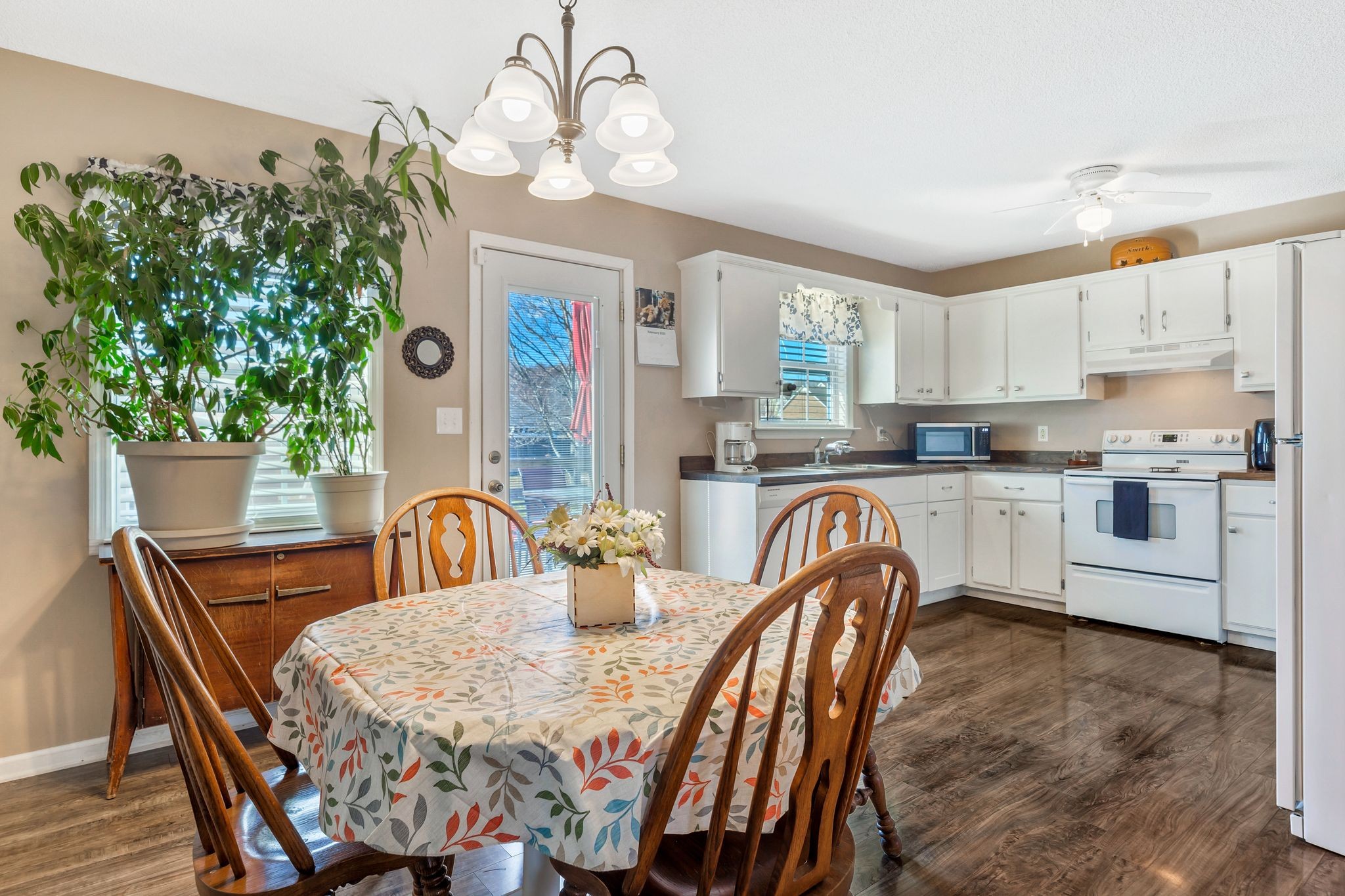 740 Happy Valley Road Bell Buckle, TN 37020 - Photo 12 of 33 a view of a dining room with furniture window and wooden floor