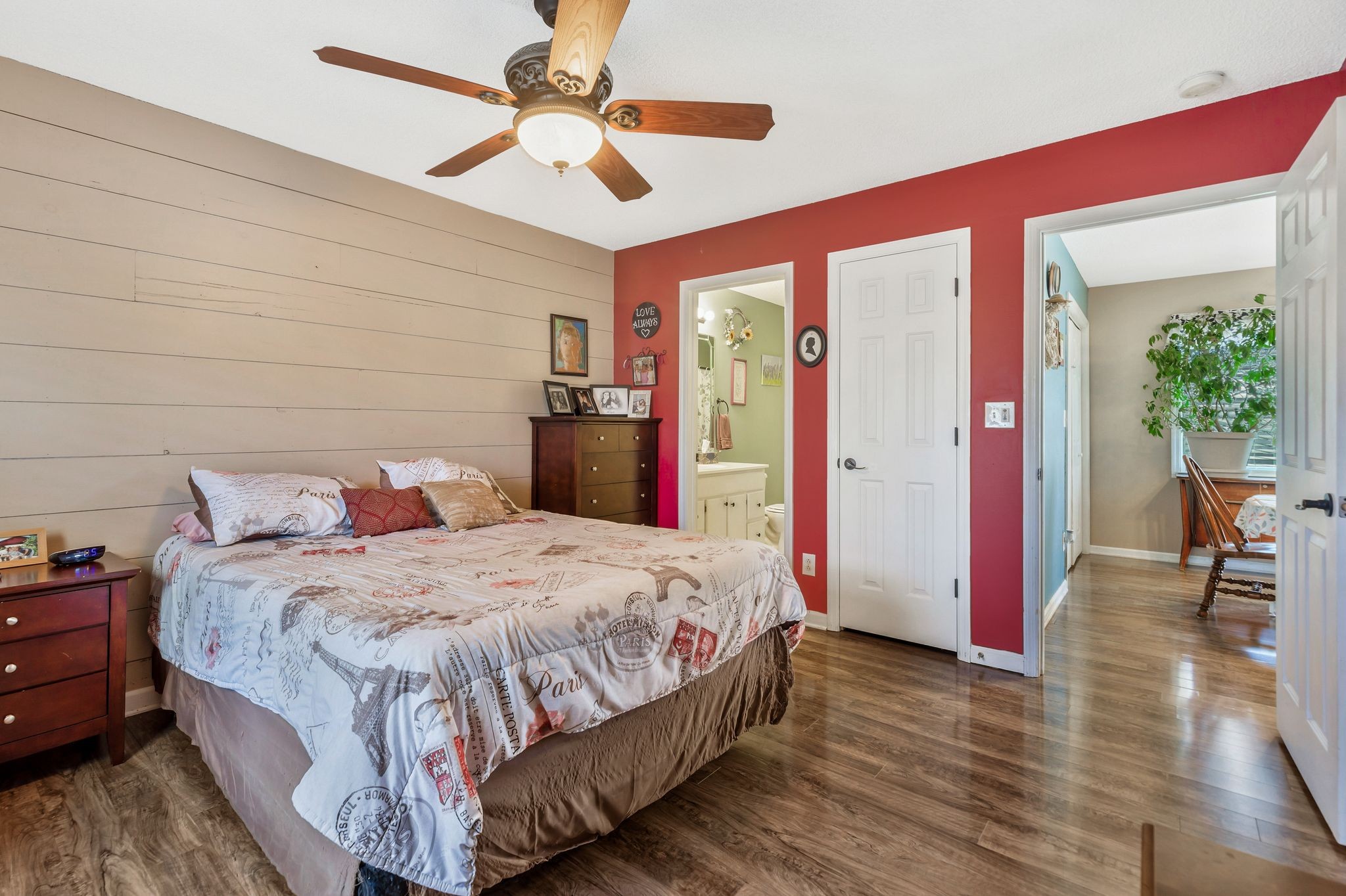 740 Happy Valley Road Bell Buckle, TN 37020 - Photo 19 of 33 a bedroom with a bed and a chandelier