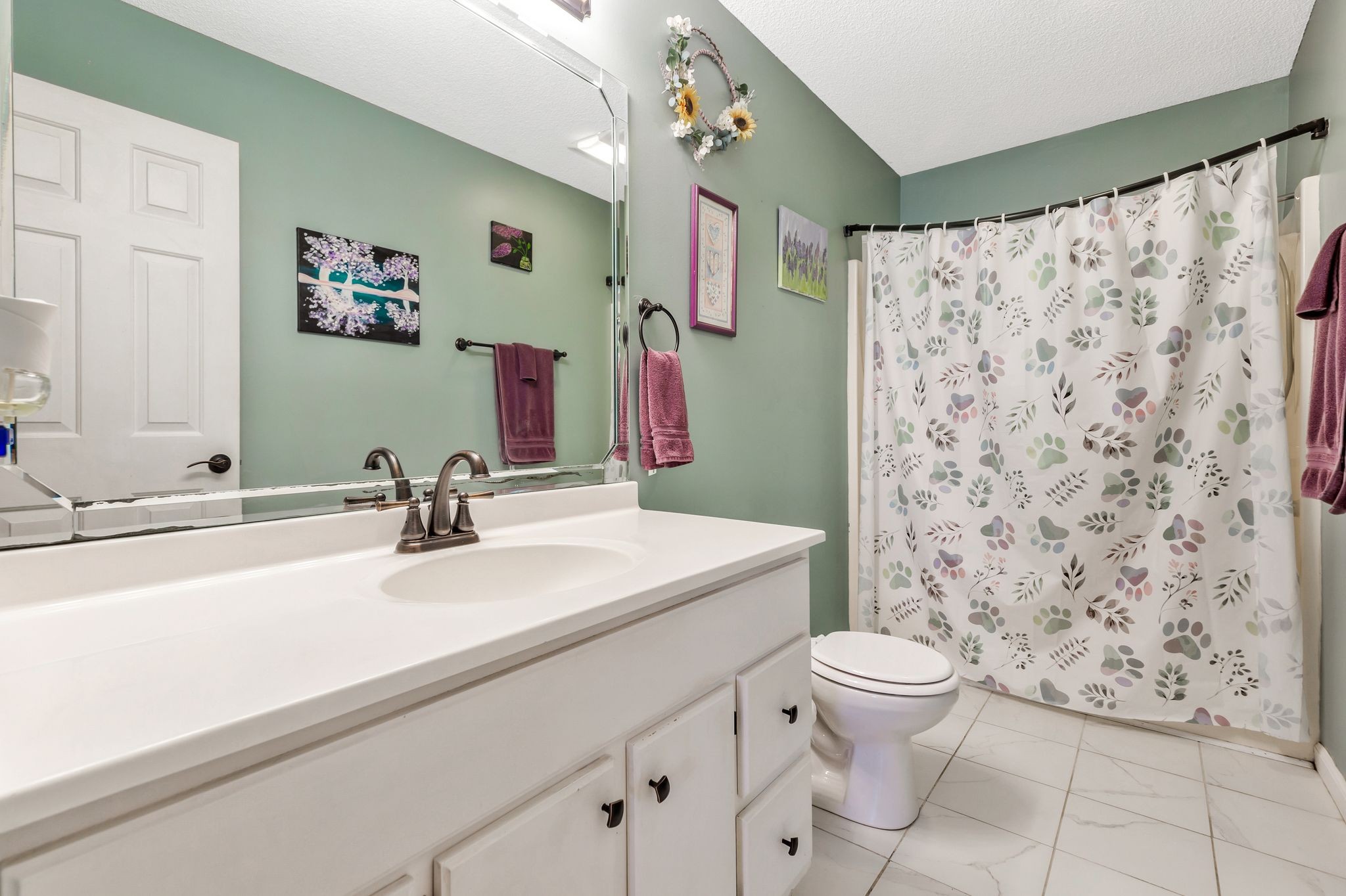 740 Happy Valley Road Bell Buckle, TN 37020 - Photo 20 of 33 a bathroom with a sink a toilet and a mirror