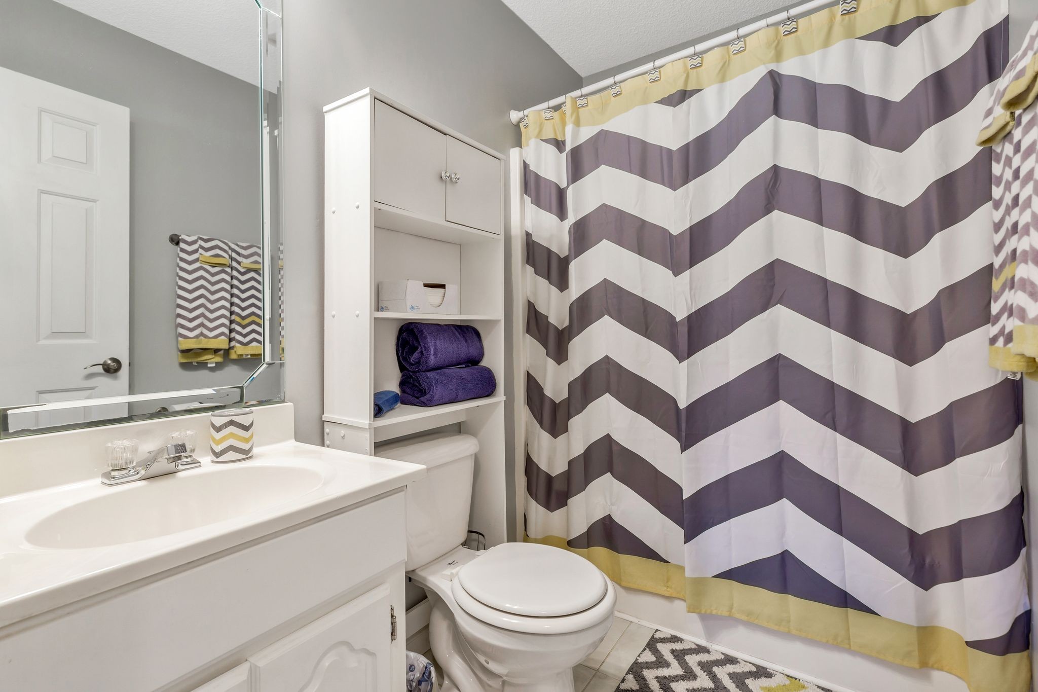 740 Happy Valley Road Bell Buckle, TN 37020 - Photo 22 of 33 a bathroom with a sink a toilet and a mirror