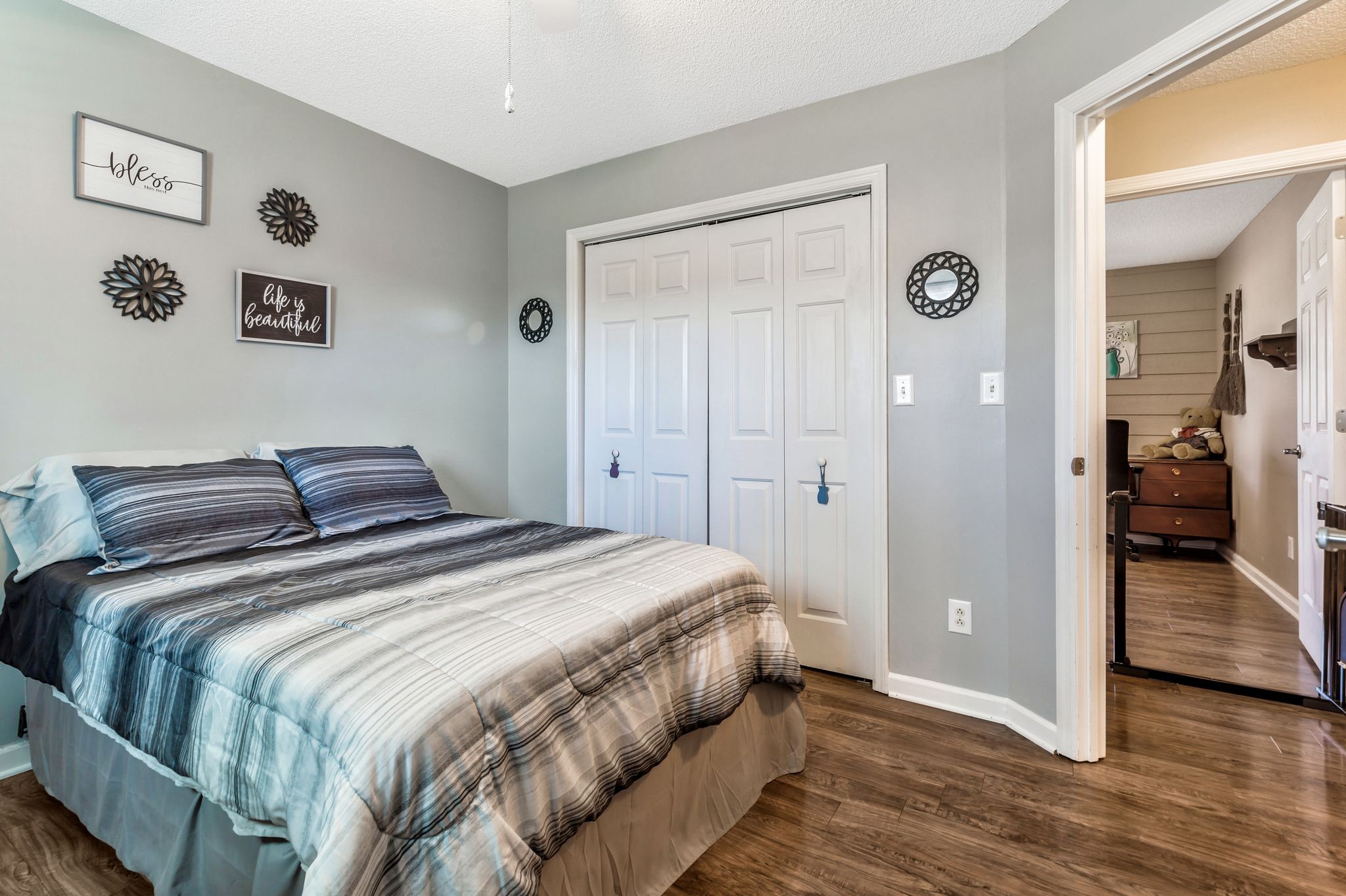 740 Happy Valley Road Bell Buckle, TN 37020 - Photo 24 of 33 a bedroom with a bed and painting on the wall