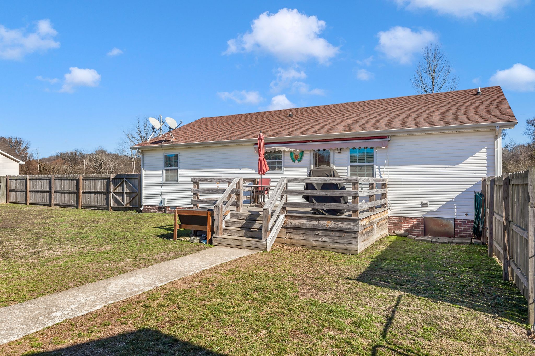 740 Happy Valley Road Bell Buckle, TN 37020 - Photo 29 of 33 a view of a house with backyard porch and a garden