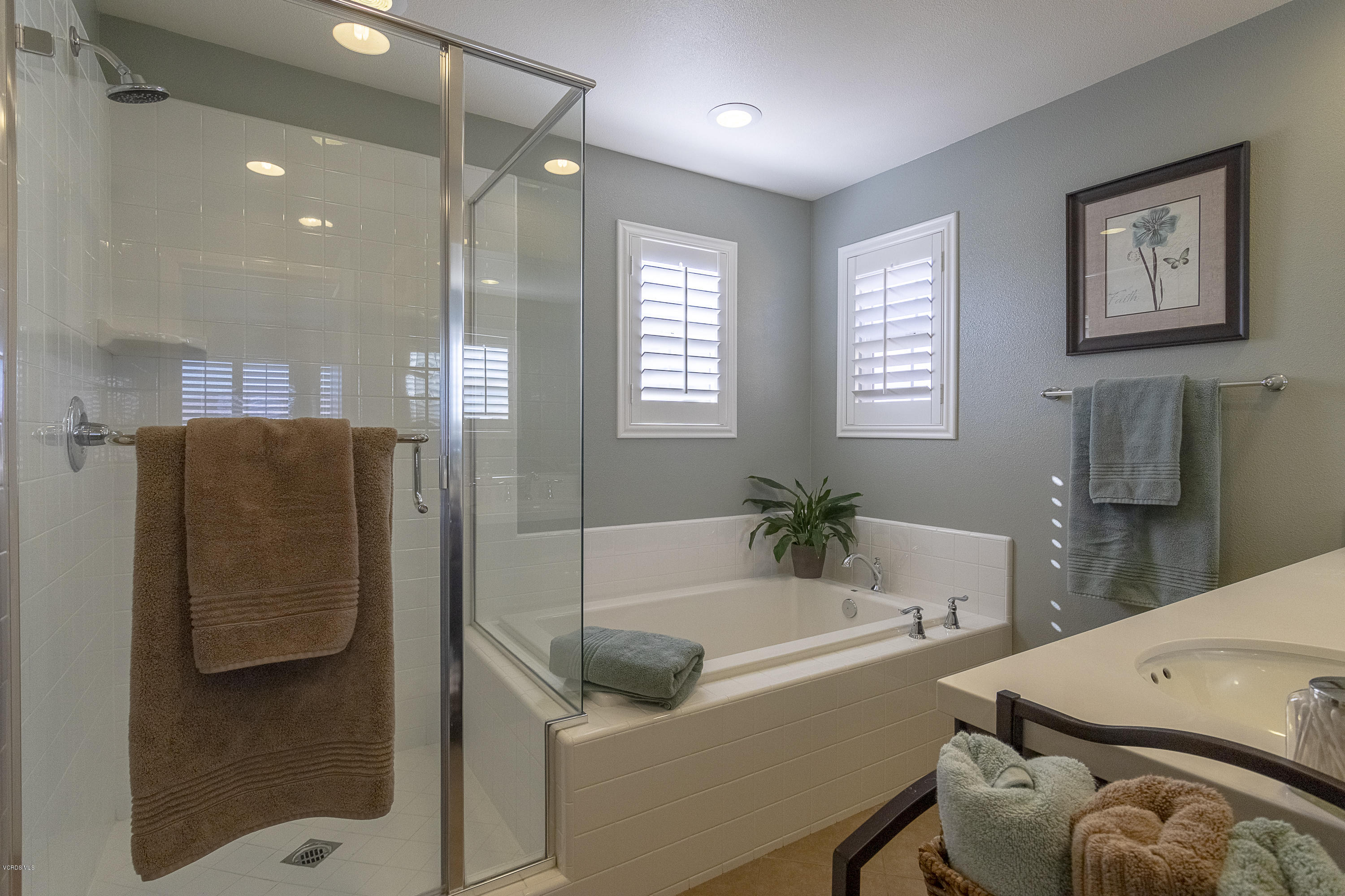 613 Xanadu Way Oxnard, CA 93036 - Photo 13 of 30 a bathroom with a tub and a shower