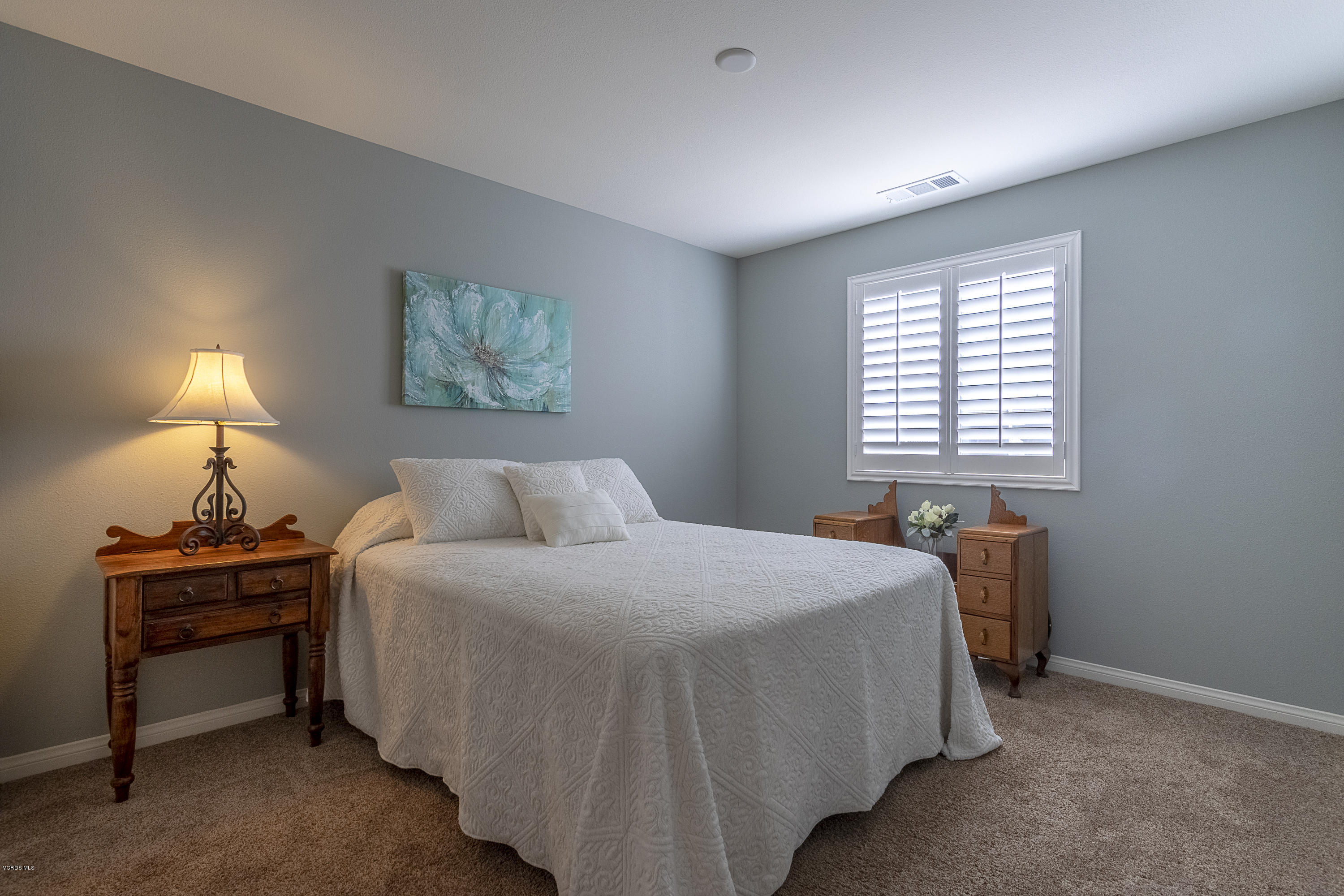 613 Xanadu Way Oxnard, CA 93036 - Photo 15 of 30 a bedroom with a bed and a lamp on dresser