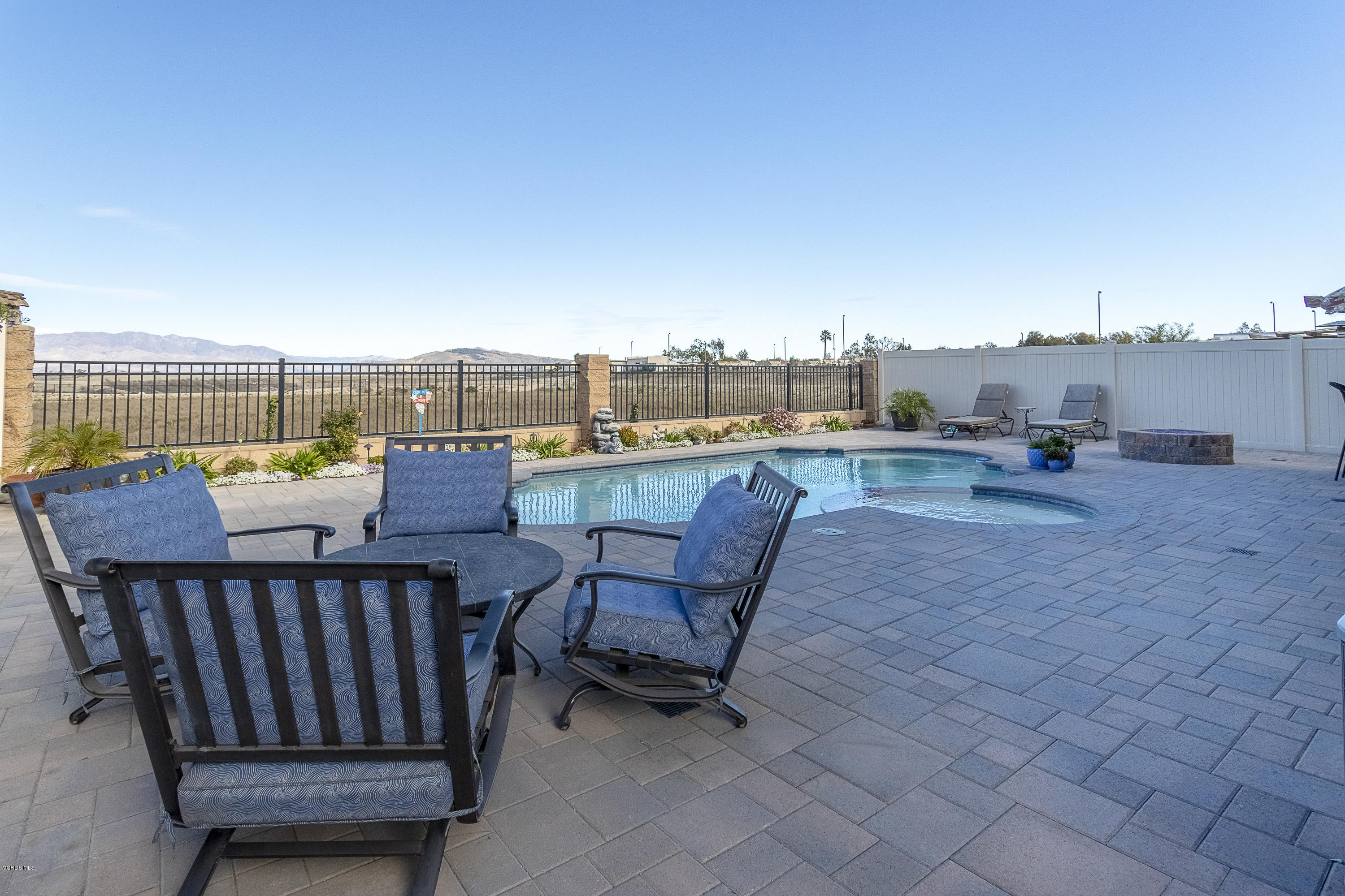 613 Xanadu Way Oxnard, CA 93036 - Photo 20 of 30 an outdoor sitting area with furniture and wooden floor
