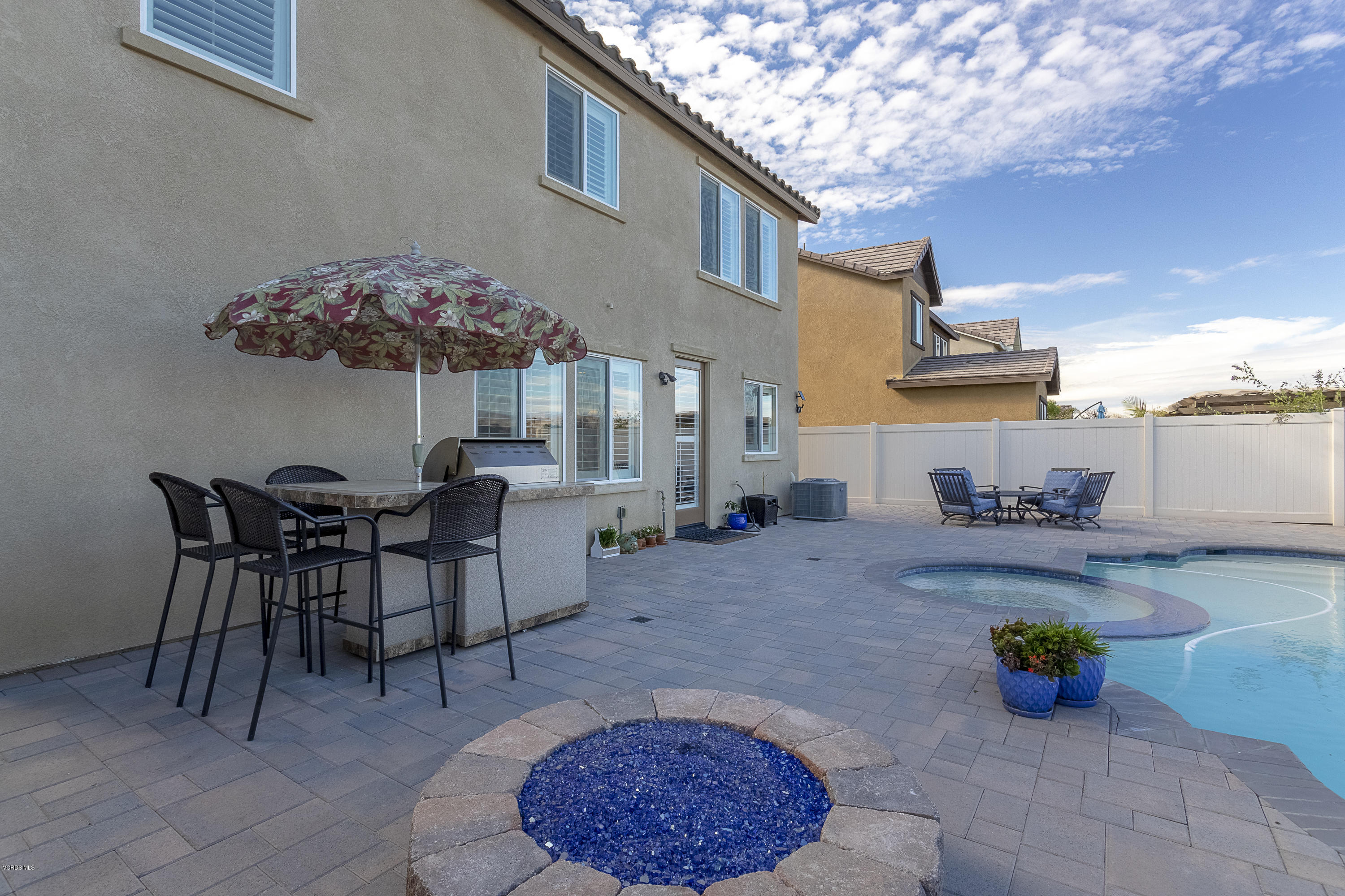 613 Xanadu Way Oxnard, CA 93036 - Photo 22 of 30 a view of a dining room with furniture and chandelier