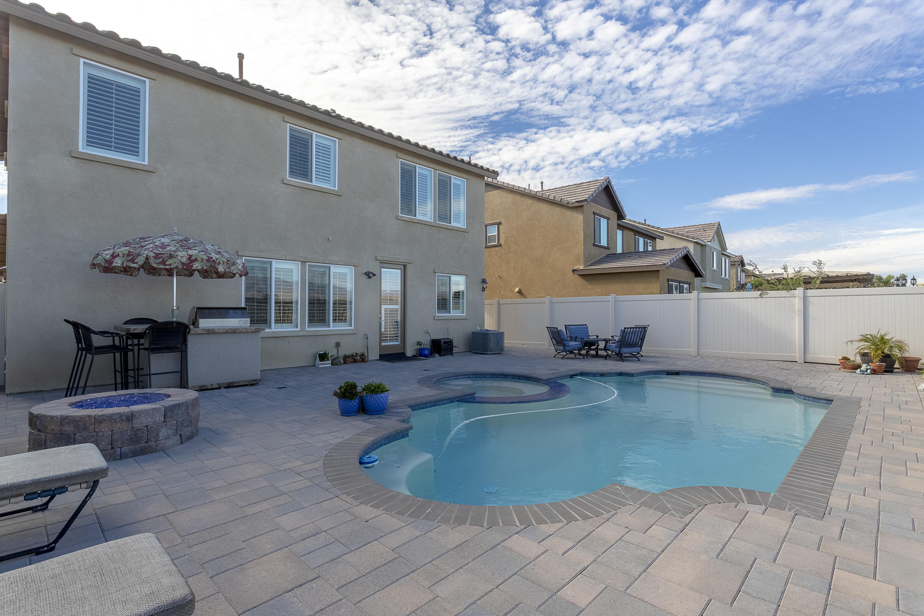 613 Xanadu Way Oxnard, CA 93036 - Photo 23 of 30 a swimming pool with yard and outdoor seating