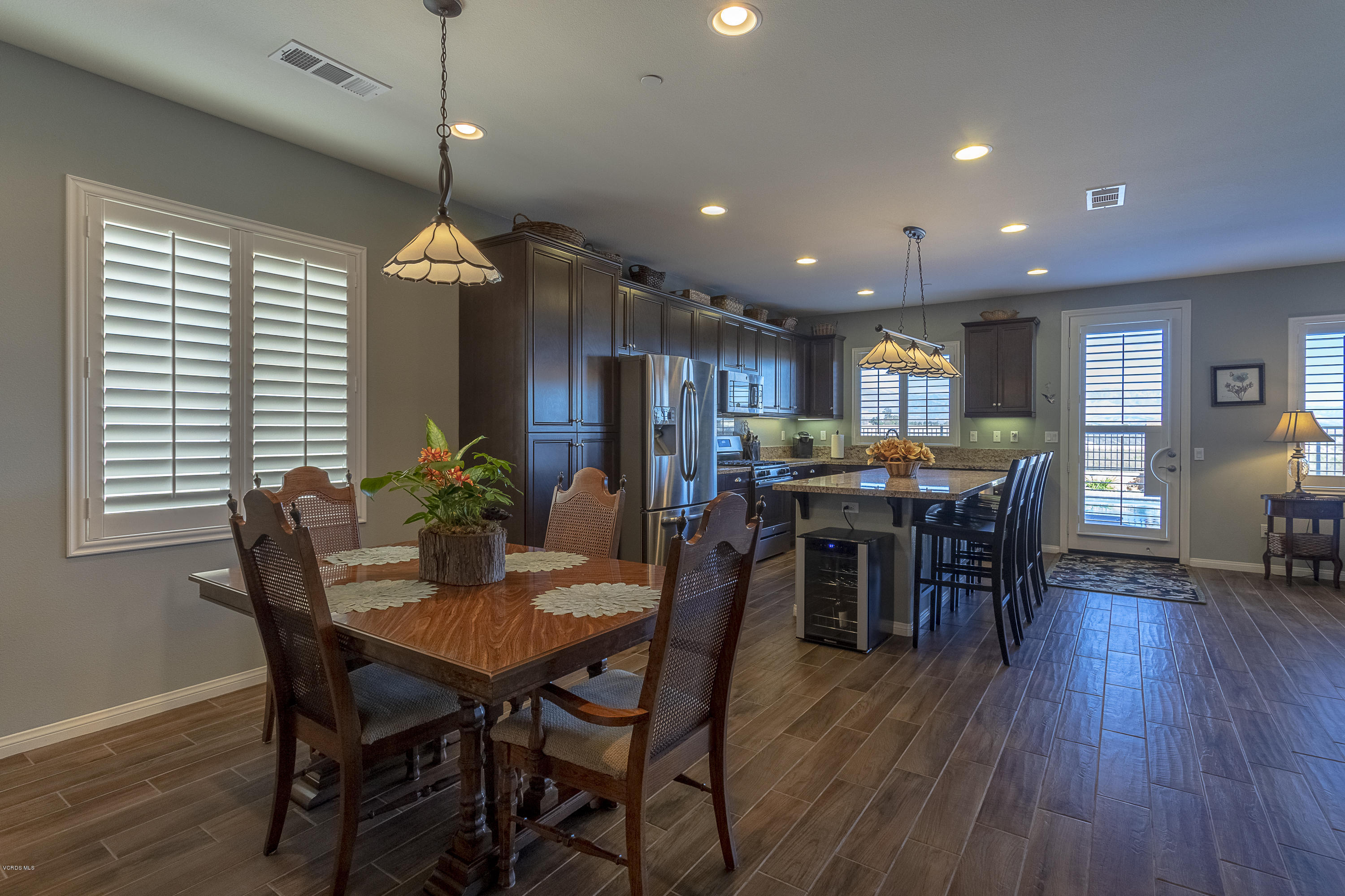 613 Xanadu Way Oxnard, CA 93036 - Photo 6 of 30 a view of a dining room with furniture window and wooden floor