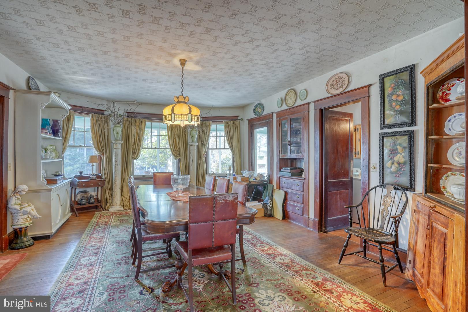 4096 Main Street Trappe, MD 21673 - Photo 24 of 70 a dining room with furniture a chandelier and window