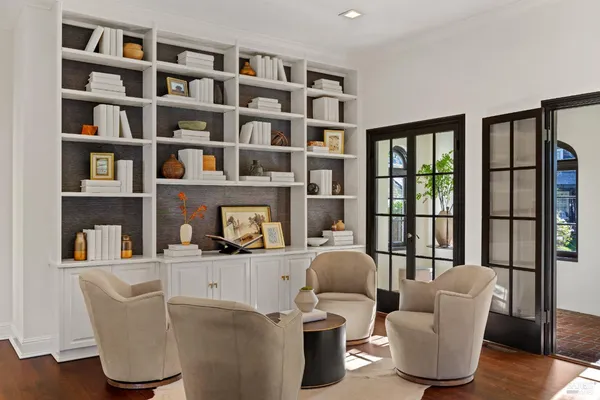 a dining room with furniture dining table and a large window