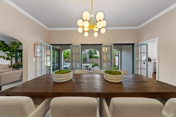 a dining room with furniture and wooden floor