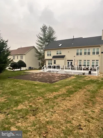 a swimming pool view with a outdoor seating