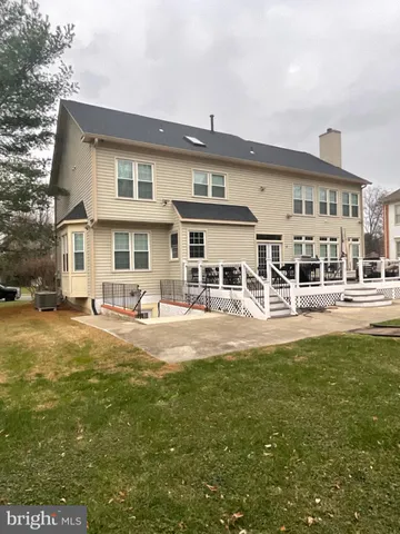 a view of house with a garden