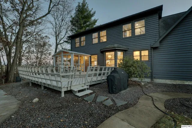 a view of a patio with a table chairs and a potted plant