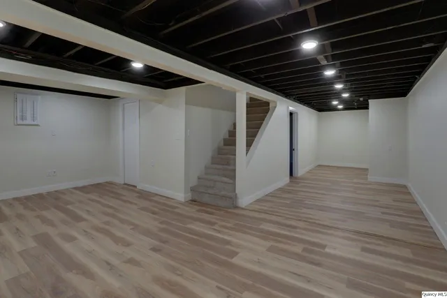a view of room with wooden floor