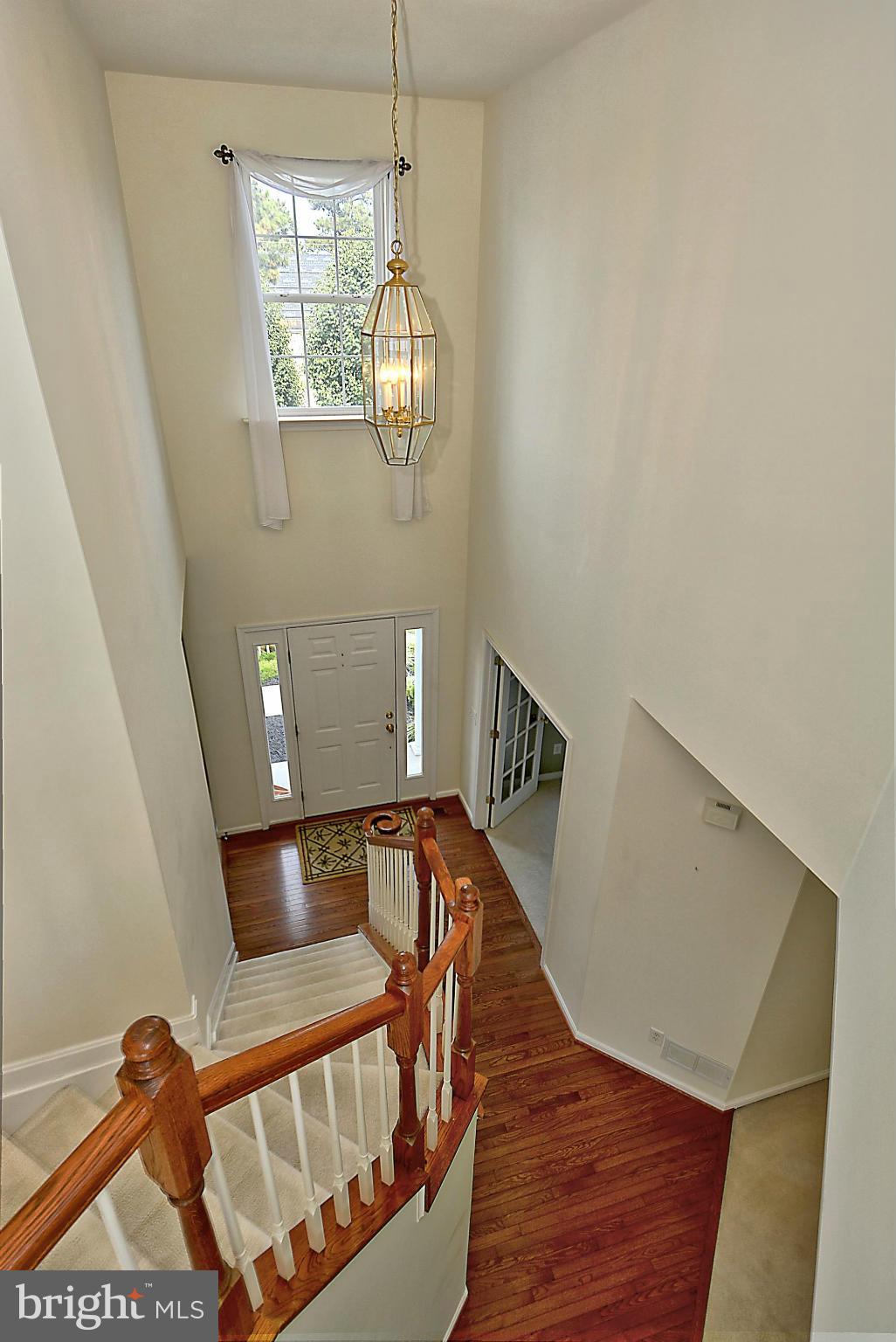 1001 Long Point Road Grasonville, MD 21638 - Photo 12 of 29 a view of wooden floor and windows in a room