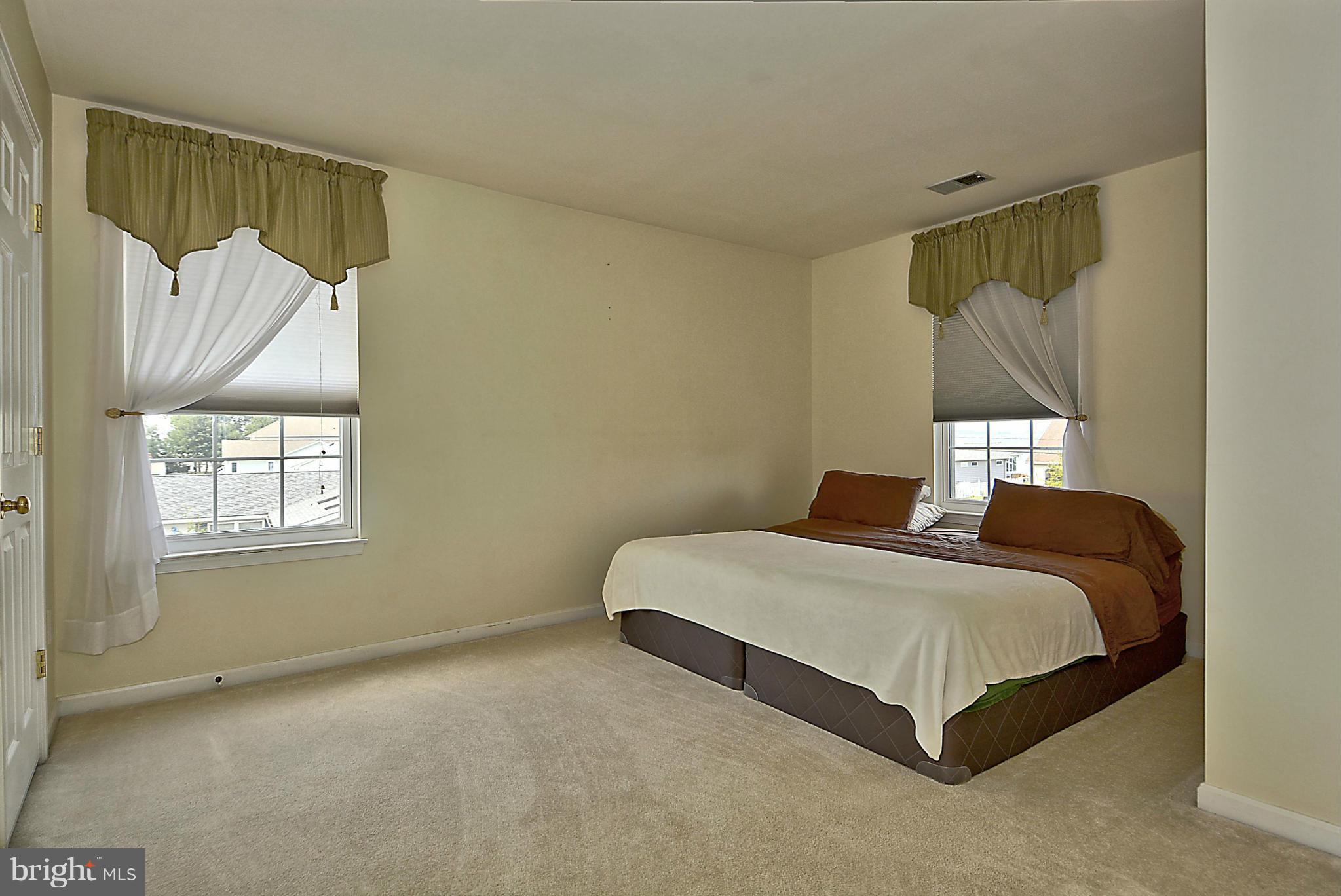 1001 Long Point Road Grasonville, MD 21638 - Photo 14 of 29 a bedroom with a bed and window