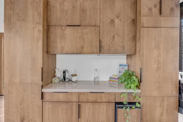 a sink with a potted plant on it