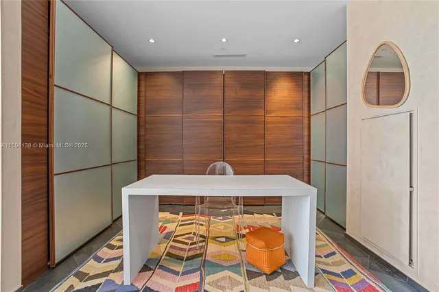 a living room with furniture fireplace and a table