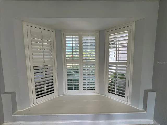 a view of a room with a large window