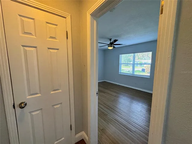 a view of an empty room with a window
