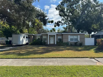 a view of a yard with a house and swimming pool
