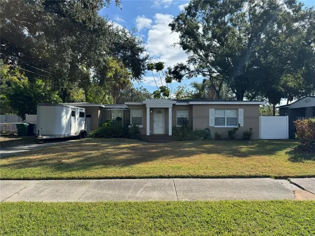 a view of a yard with a house and swimming pool