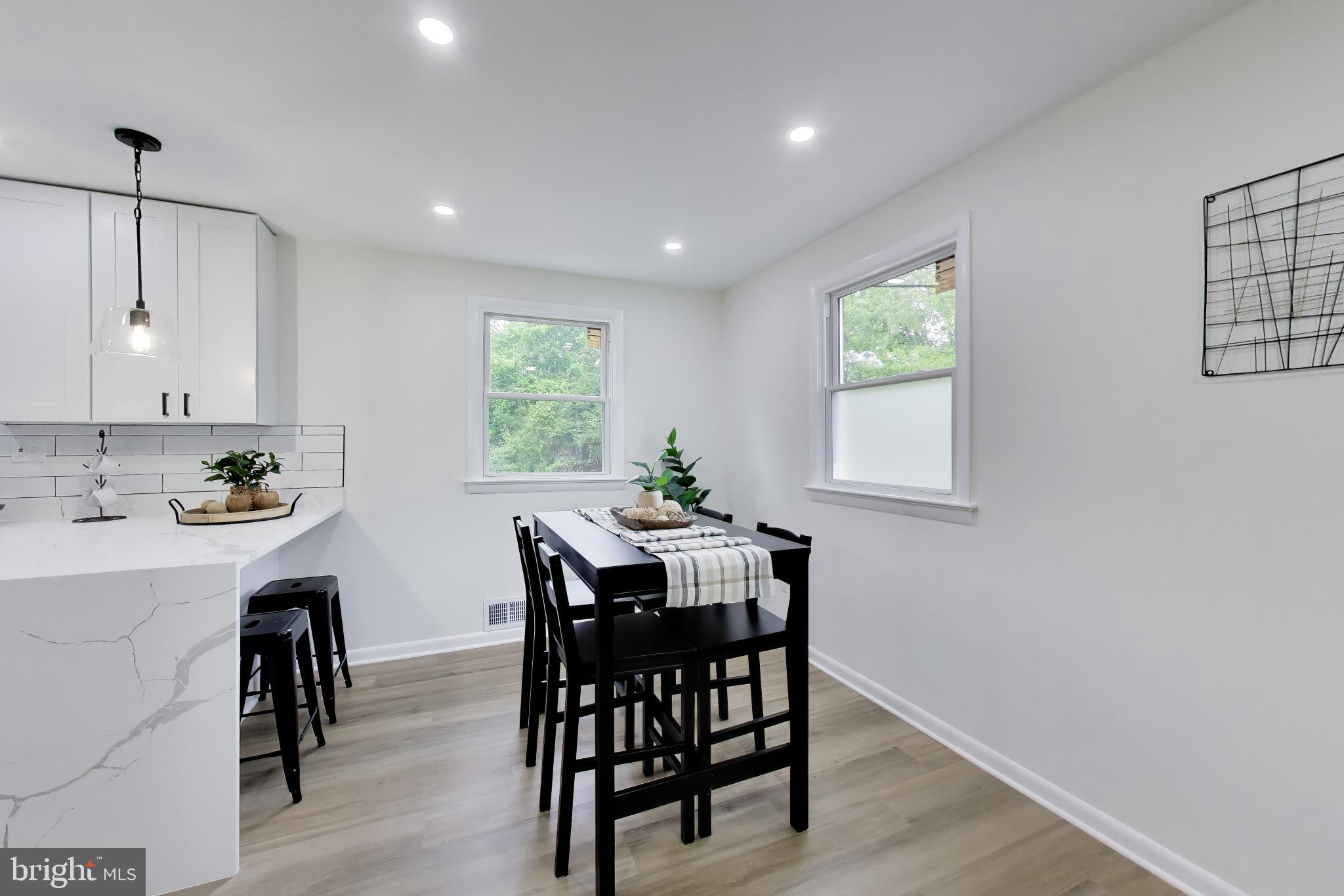 11309 Keystone Avenue Clinton, MD 20735 - Photo 6 of 36 a view of a dining room with furniture and window