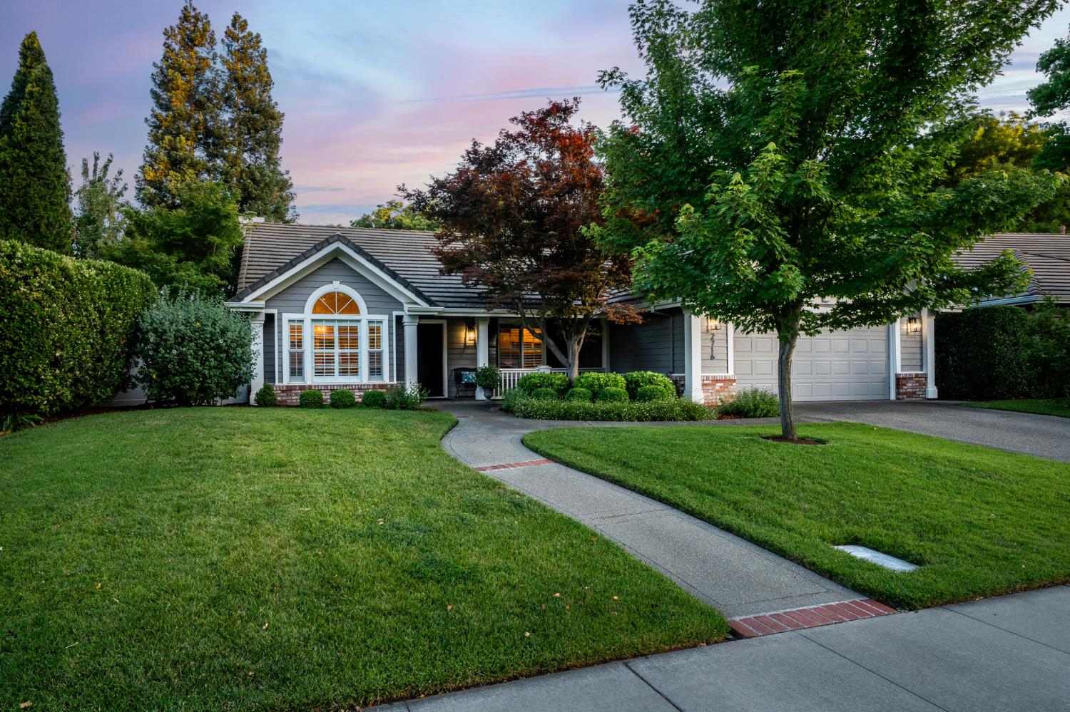 a front of a house with a yard