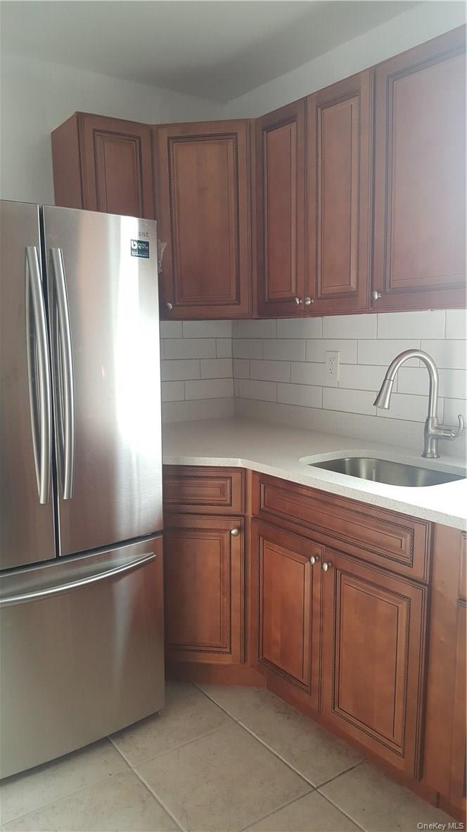 14-16 Horton Avenue, Unit 1 New Rochelle, NY 10801 - Photo 2 of 25 a kitchen with a refrigerator sink and cabinets