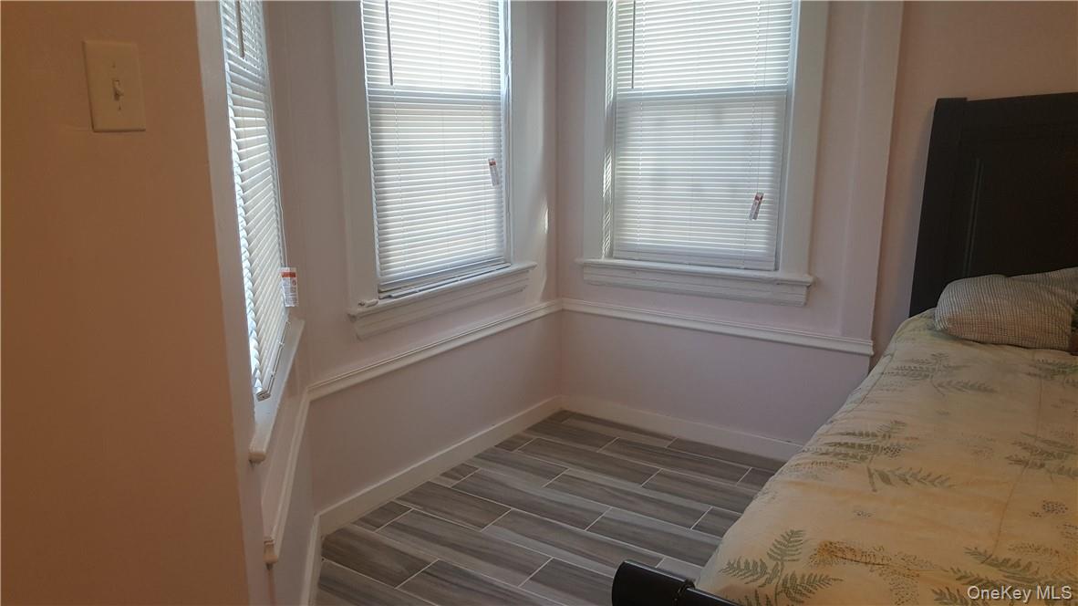 14-16 Horton Avenue, Unit 1 New Rochelle, NY 10801 - Photo 9 of 25 a view of a closet area with wooden floor