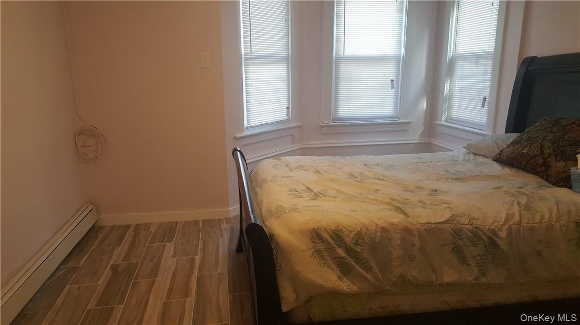 14-16 Horton Avenue, Unit 1 New Rochelle, NY 10801 - Photo 10 of 25 a bedroom with a bed and a window