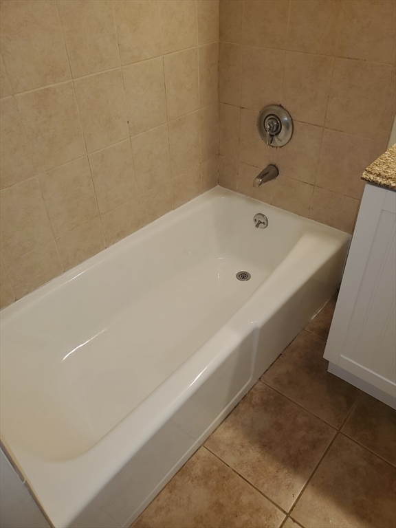 11 Wampus Avenue, Unit 14 Acton, MA 01720 - Photo 7 of 8 a bathroom with a bathtub