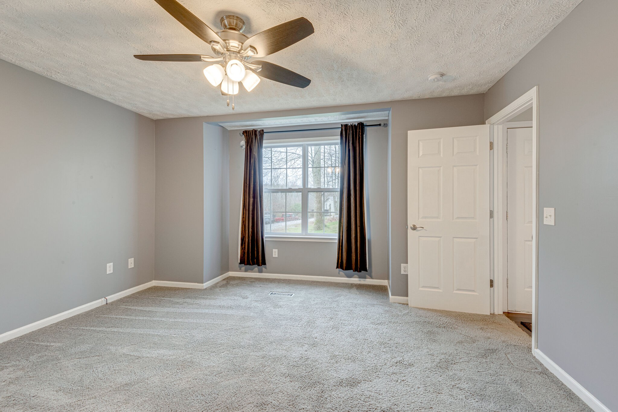 1121 Deer Ridge Road Kingston Springs, TN 37082 - Photo 14 of 27 a view of an empty room with a window