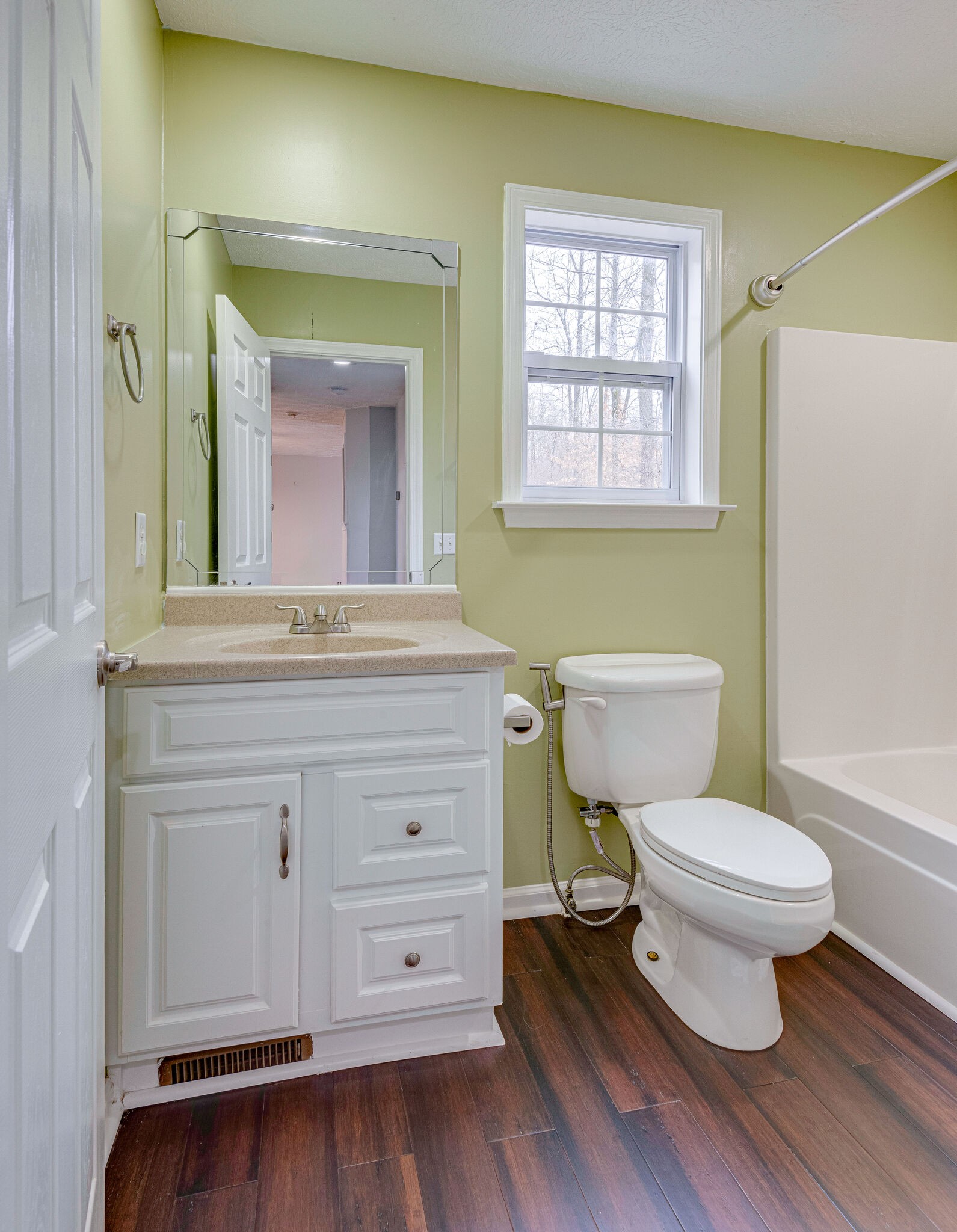 1121 Deer Ridge Road Kingston Springs, TN 37082 - Photo 21 of 27 a bathroom with a toilet a sink and a window