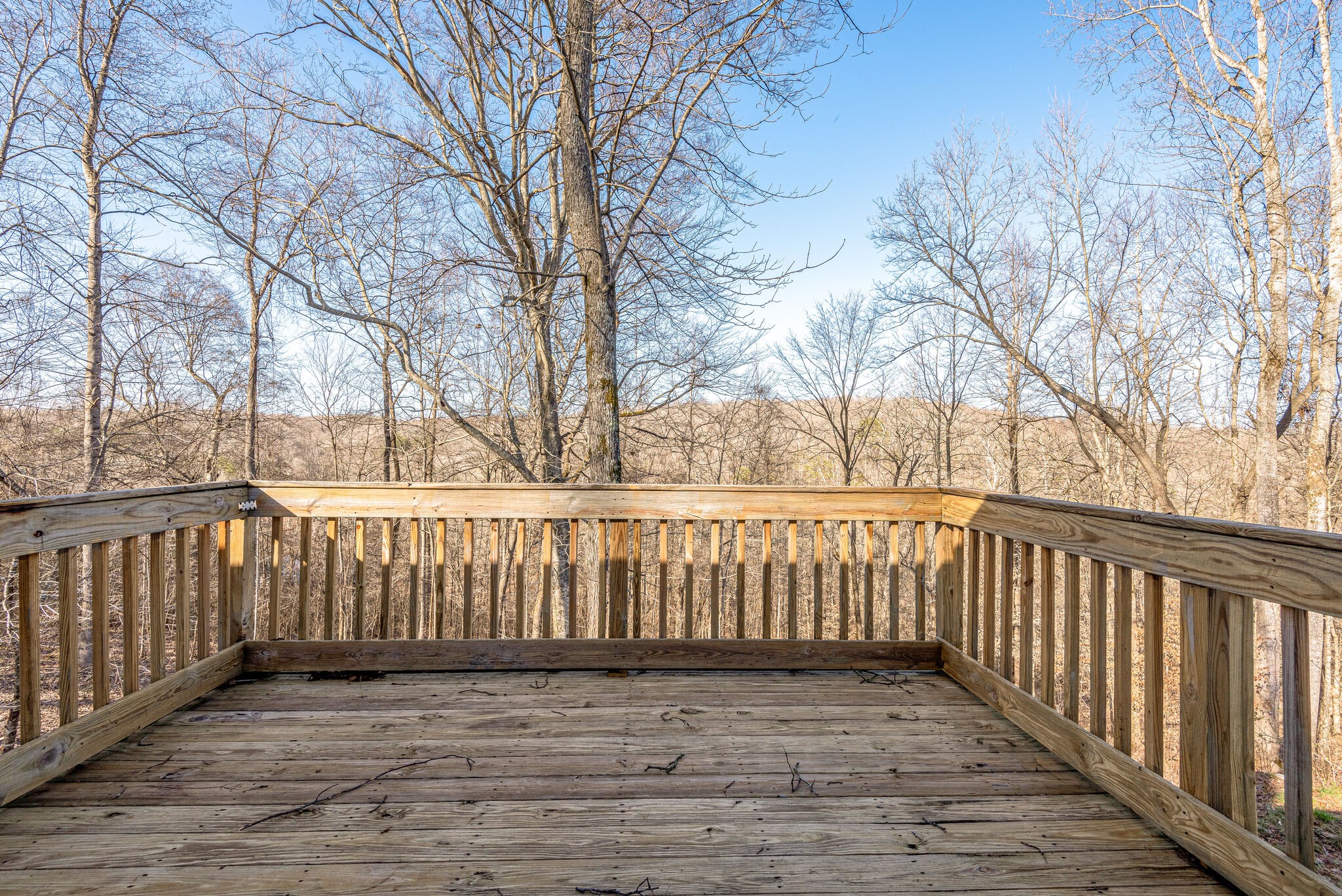 1121 Deer Ridge Road Kingston Springs, TN 37082 - Photo 25 of 27 a view of a balcony with wooden fence and floor