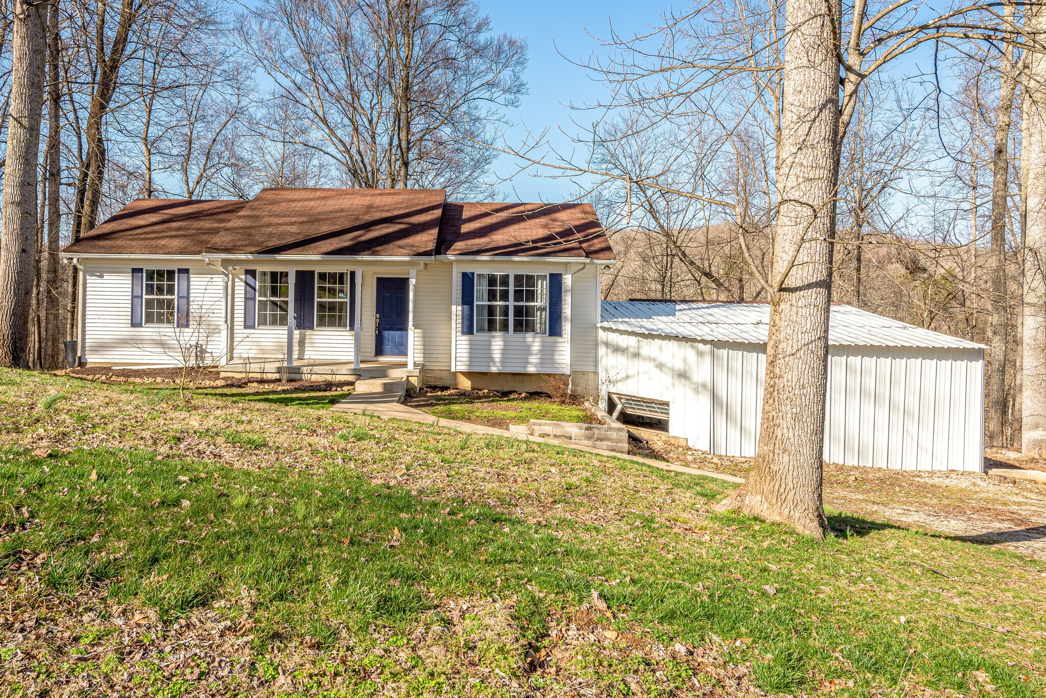 1121 Deer Ridge Road Kingston Springs, TN 37082 - Photo 3 of 27 a front view of a house with a yard