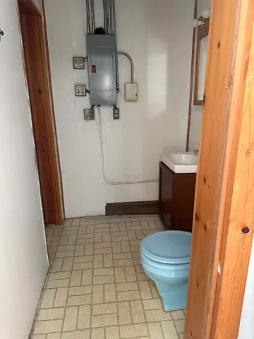 a bathroom with a sink and toilet
