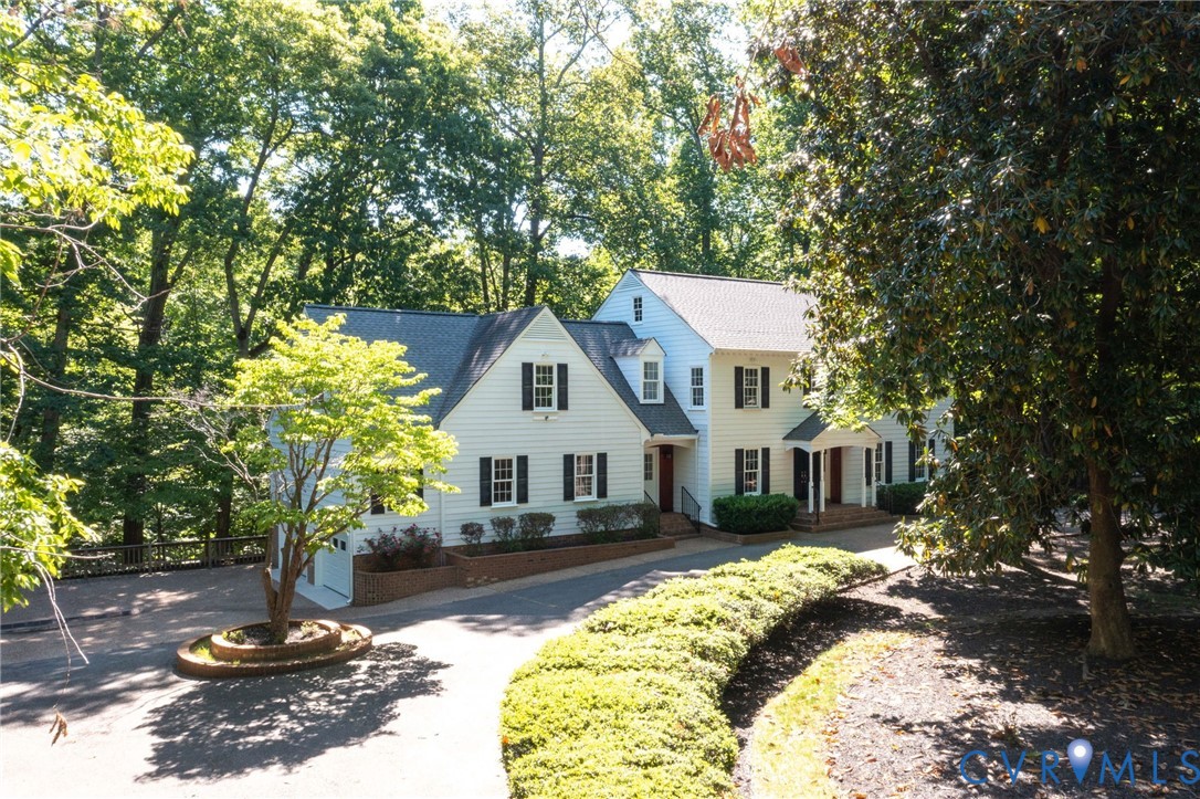3201 East Brigstock Road Midlothian, VA 23113 - Photo 63 of 72 a front view of a house with a yard table and chairs